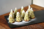 Cone-shaped Christmas Tree Cakes on a slate